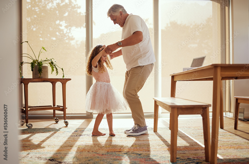 Grandfather, girl and dance holding hands in living room home. Love, smile and happy cute daughter dancing with caring grandpa spending time together, bonding and care having fun on weekend in house.